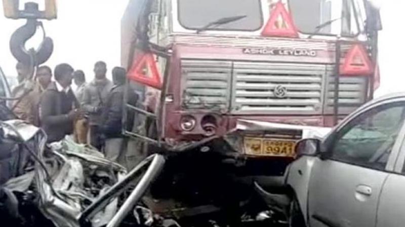 2 killed as car rams into stationary truck
