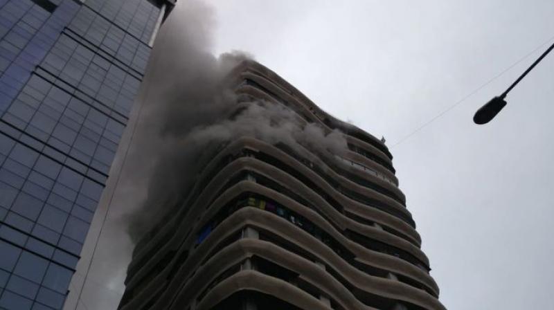 A fire broke out in a posh residential building A fire broke out in a posh residential building
