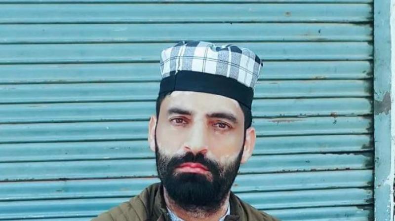 Shabir Ahmad Bhat's body found in the fields at Rakh-e-Litter area Shabir Ahmad Bhat's body found in the fields at Rakh-e-Litter area