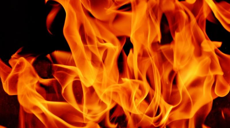 Girl Child thrown in fire by mother