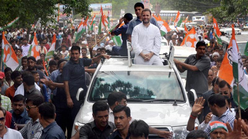 Rahul holds road show in Raman's home turf Rahul holds road show in Raman's home turf