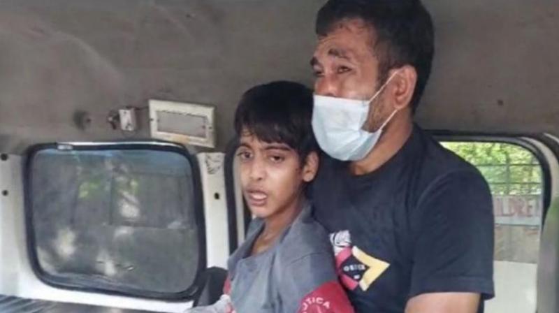 14-year-old Shahvaz with father 14-year-old Shahvaz with father