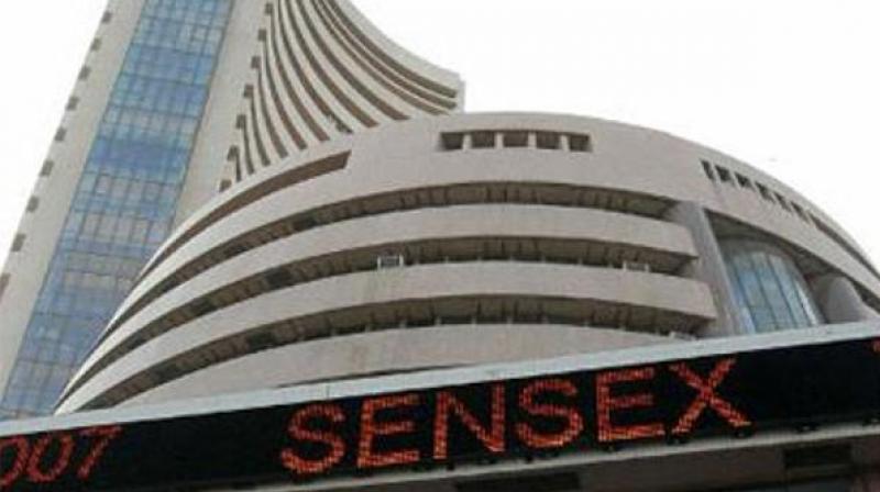 Sensex pares gains