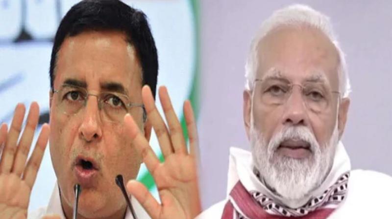 Randeep Surjewala and Narendra Modi