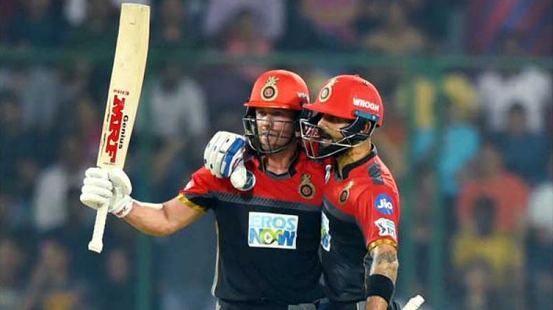 AB de Villiers celebrates his fifty runs with captain Virat Kohli AB de Villiers celebrates his fifty runs with captain Virat Kohli