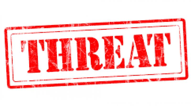 Man held for rape threat Man held for rape threat