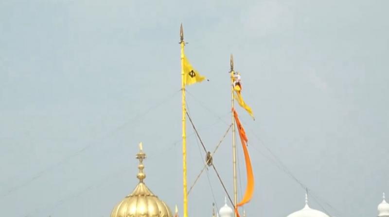 Back To History, Nishan Sahib's Colour at Sri Akal Takht Sahib Changed From Kesari to Basanti Back To History, Nishan Sahib's Colour at Sri Akal Takht Sahib Changed From Kesari to Basanti