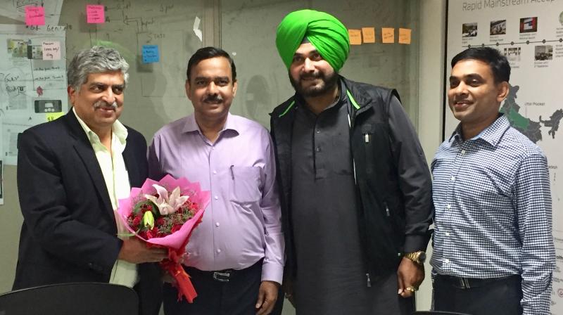 Navjot Singh Sidhu calls on Infosys co-founder Nandan Nilekani 