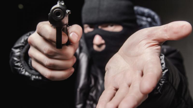 A man robbed by four unidentified persons at gunpoint A man robbed by four unidentified persons at gunpoint