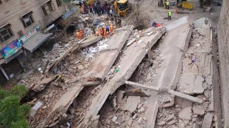 Four-storey building collapses Four-storey building collapses