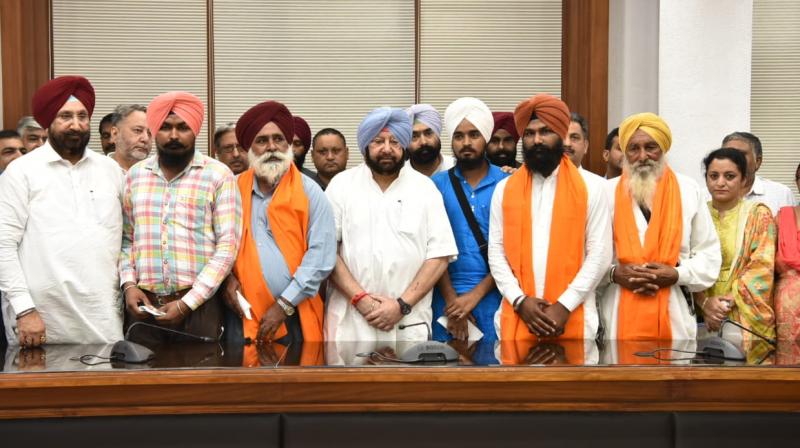 Pb CM handed over cheques Pb CM handed over cheques