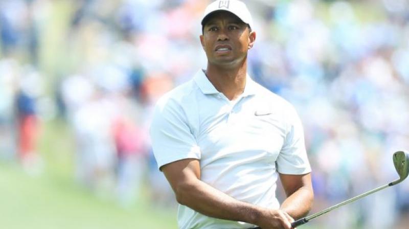 Tiger happy with new putter Tiger happy with new putter