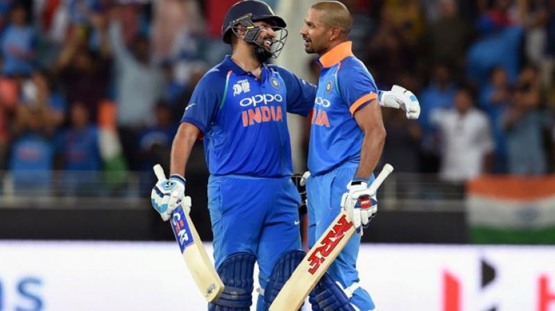 Half centuries from Rohit, Dhawan