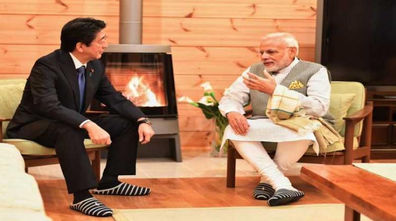 PM Modi holds informal talks with Abe PM Modi holds informal talks with Abe
