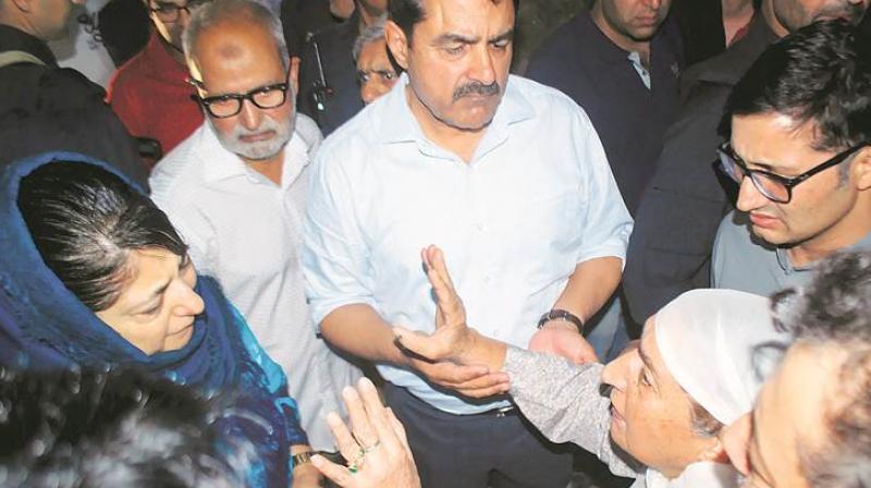 J&K Chief Minister Mehbooba Mufti with relatives of Shujaat Bukhari