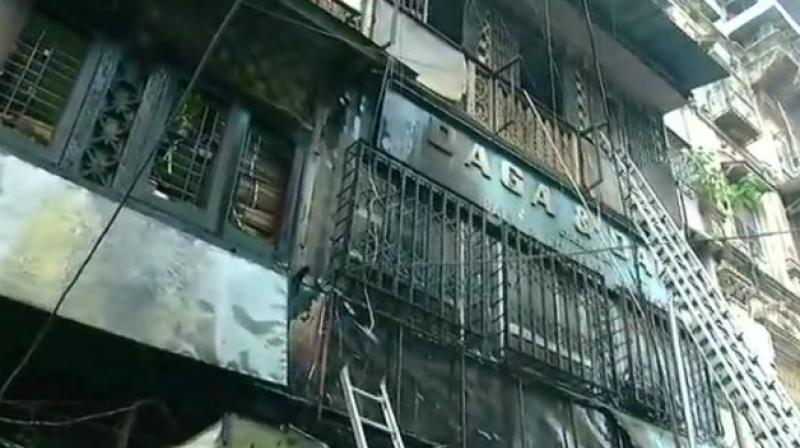 Part of Mumbai building collapses after fire Part of Mumbai building collapses after fire