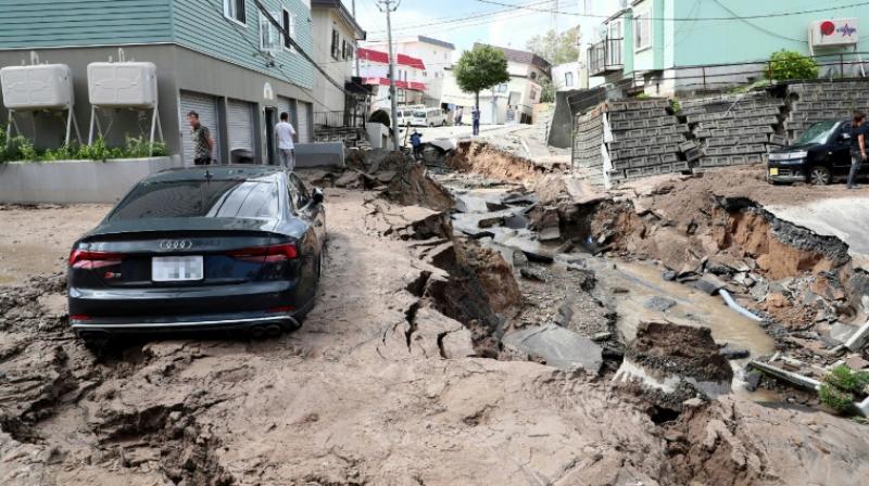 Toll from Japan quake rises to 18 as hopes fade for survivors