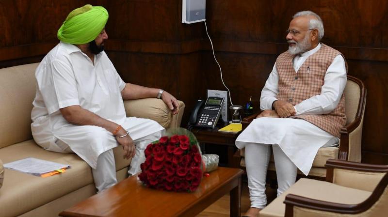 Captain Amarinder Singh and Narendra Modi