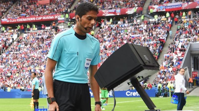 Football referees watching slow motion videos Football referees watching slow motion videos