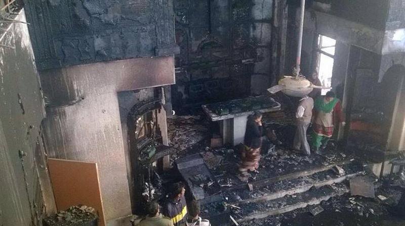 Three houses, seven shops gutted in fire Three houses, seven shops gutted in fire