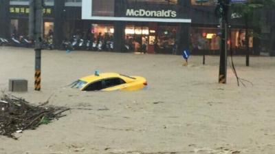 Six people have been killed by floodwaters in Taiwan