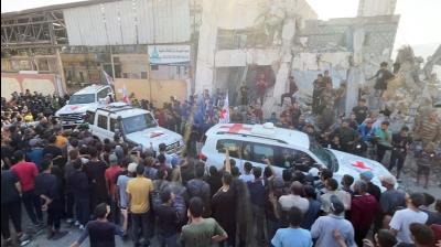 Red Cross vehicles transport hostages in Gaza City October 13, 2025  (Courtesy: Reuters)
