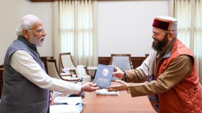 MP Hans Raj Hans Presents His book to PM Modi