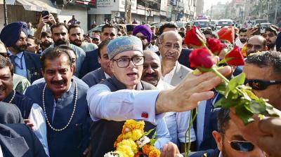 Jammu and Kashmir Chief Minister Omar Abdullah receives flowers as he arrives on the resumption of the biannual \'Darbar Move\' after a gap of four years, in Jammu, Monday, Nov. 3, 2025. The \'Darbar Move\' involves shifting the Jammu and Kashmir government\'s offices between Srinagar and Jammu with the changing seasons.