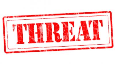 Man held for rape threat