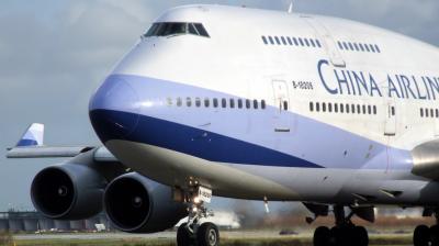 Chinese man detained after he opened the emergency exit on a plane