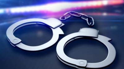 Two men were arrested today for allegedly robbing a businessman