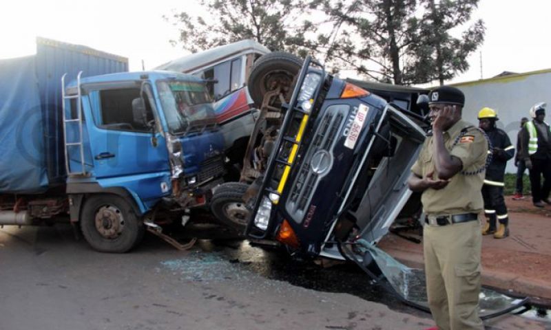 Forty-eight people died in northern Uganda when a bus hit a tractor