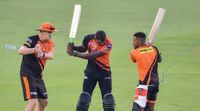 Carlos Brathwaite and Chris Jordon during a training session