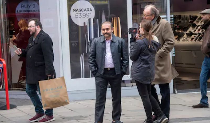 Modi can be seen sporting a handle-bar moustache and wearing an Ostrich Hide jacket