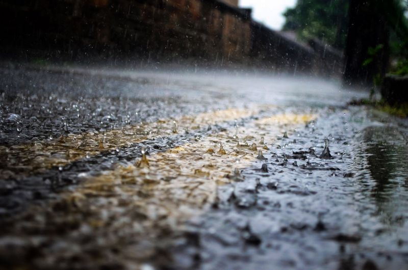 Weatherman predicting light rain towards the evening