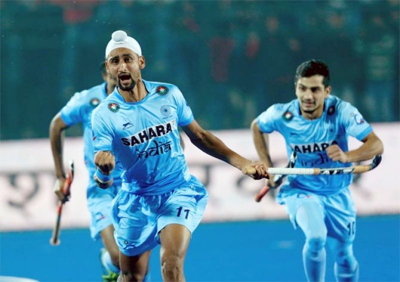 Mandeep Singh celebrates scoring for India