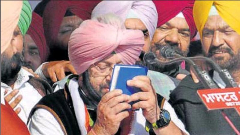 Punjab Congress chief Amarinder Singh sworn by a holy Gutka Sahib
