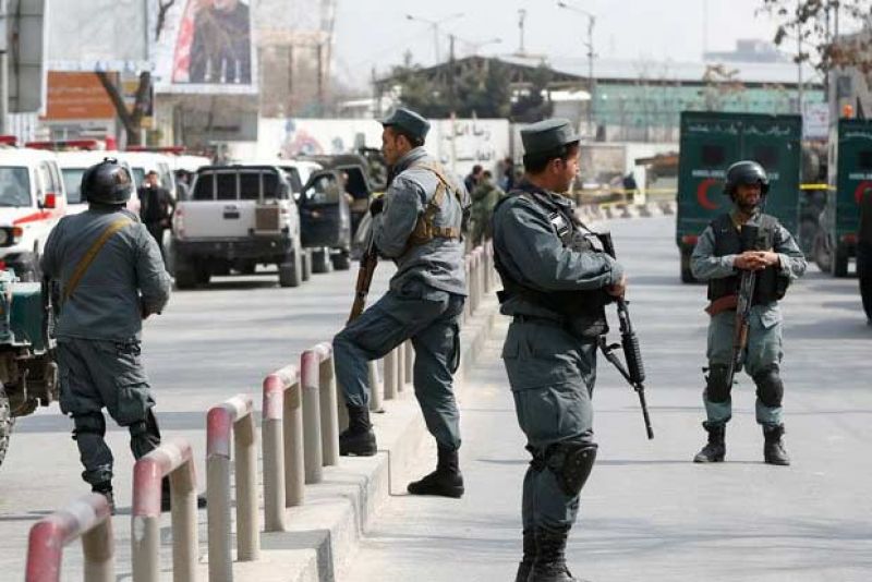 Afghan police keep watch at the site of where gunmen opened fire