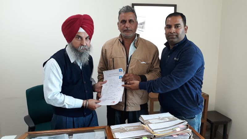 First prize winners presenting their documents to claim the prize of Punjab State Diwali Bumper-2018