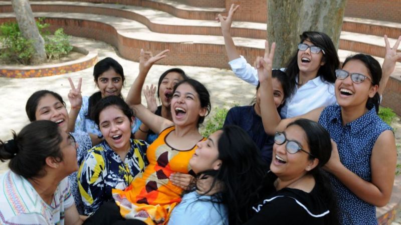 Girls celebrate their success in the CBSE Class 12 results