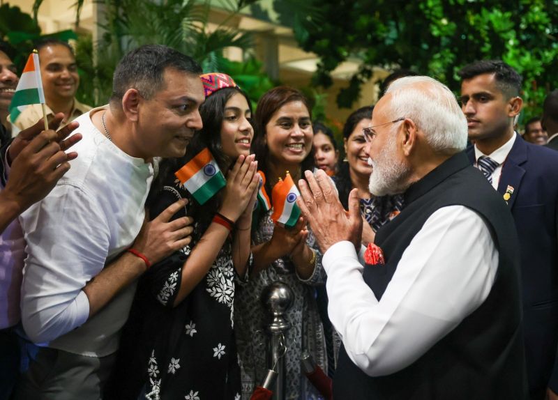 Prime Minister Modi being greeted by members of the Indian community.