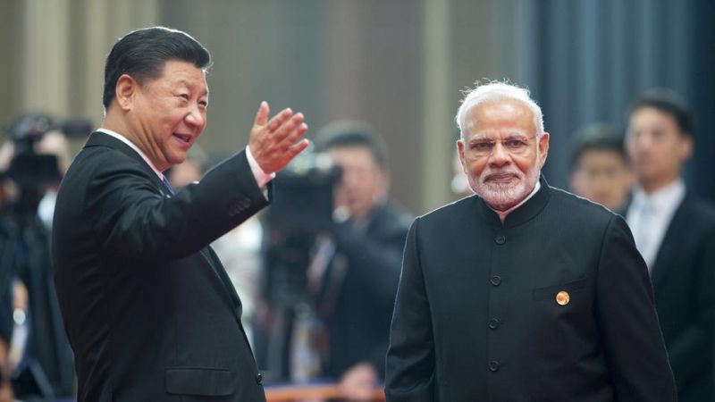 Chinese President Xi Jinping, left, welcomes Prime Minister Narendra Modi for a meeting