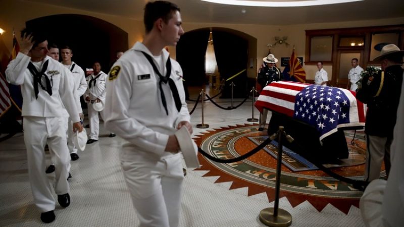 U.S. Naval sea cadets walk past the casket to pay their respects to Sen. John McCain