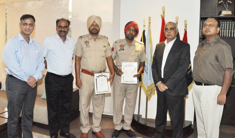 DGP Punjab Suresh Arora honoured Assistant Sub-Inspector Karamjit Singh and Head Constable Jagdish Kumar
