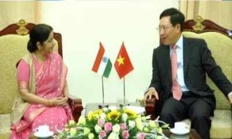 Sushma Swaraj is greeted by her Vietnamese counterpart Pham Binh Minh