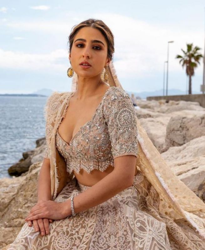 Sara Ali Khan made her Cannes red carpet debut in an ivory Abu Jani Sandeep Khosla lehenga