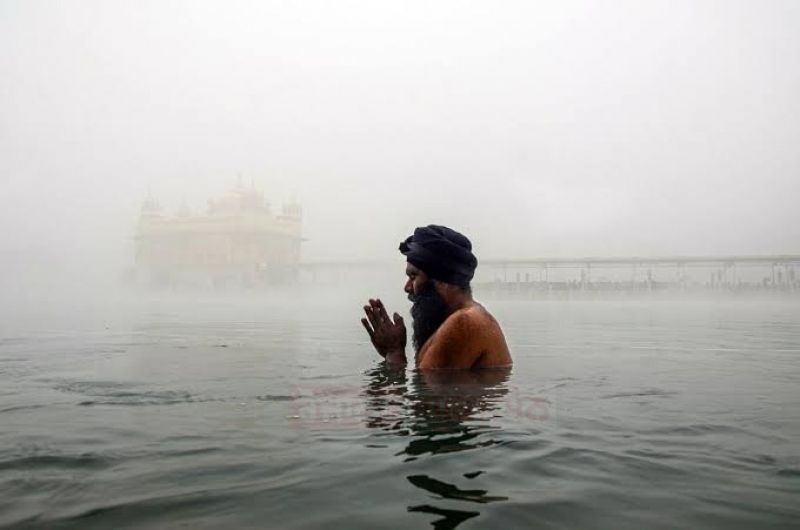 Golden Temple Embraced by Fog Blanket, Unveiling a Serene Spectacle
