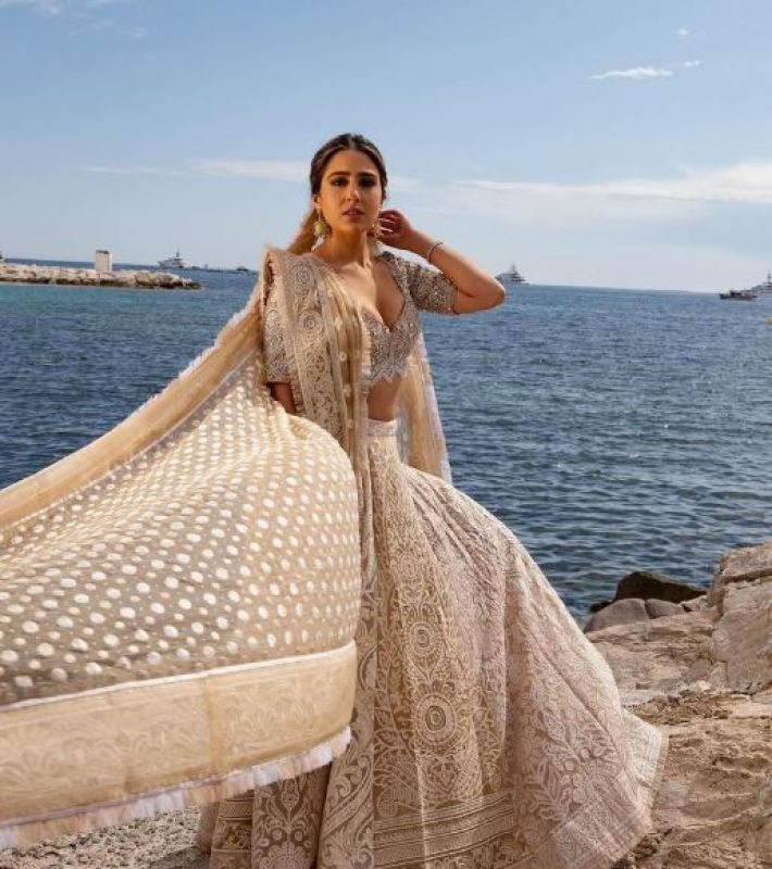 Sara Ali Khan made her Cannes red carpet debut in an ivory Abu Jani Sandeep Khosla lehenga
