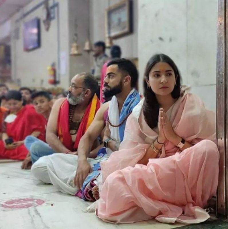 Actress donned a simple light pink saree and the cricketer wore a white dhoti
