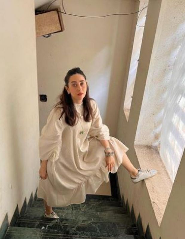 Karisma Kapoor completes her look with White Sneakers 
